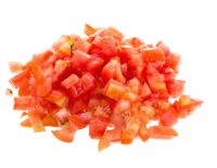 Chopped tomatoes on white background.